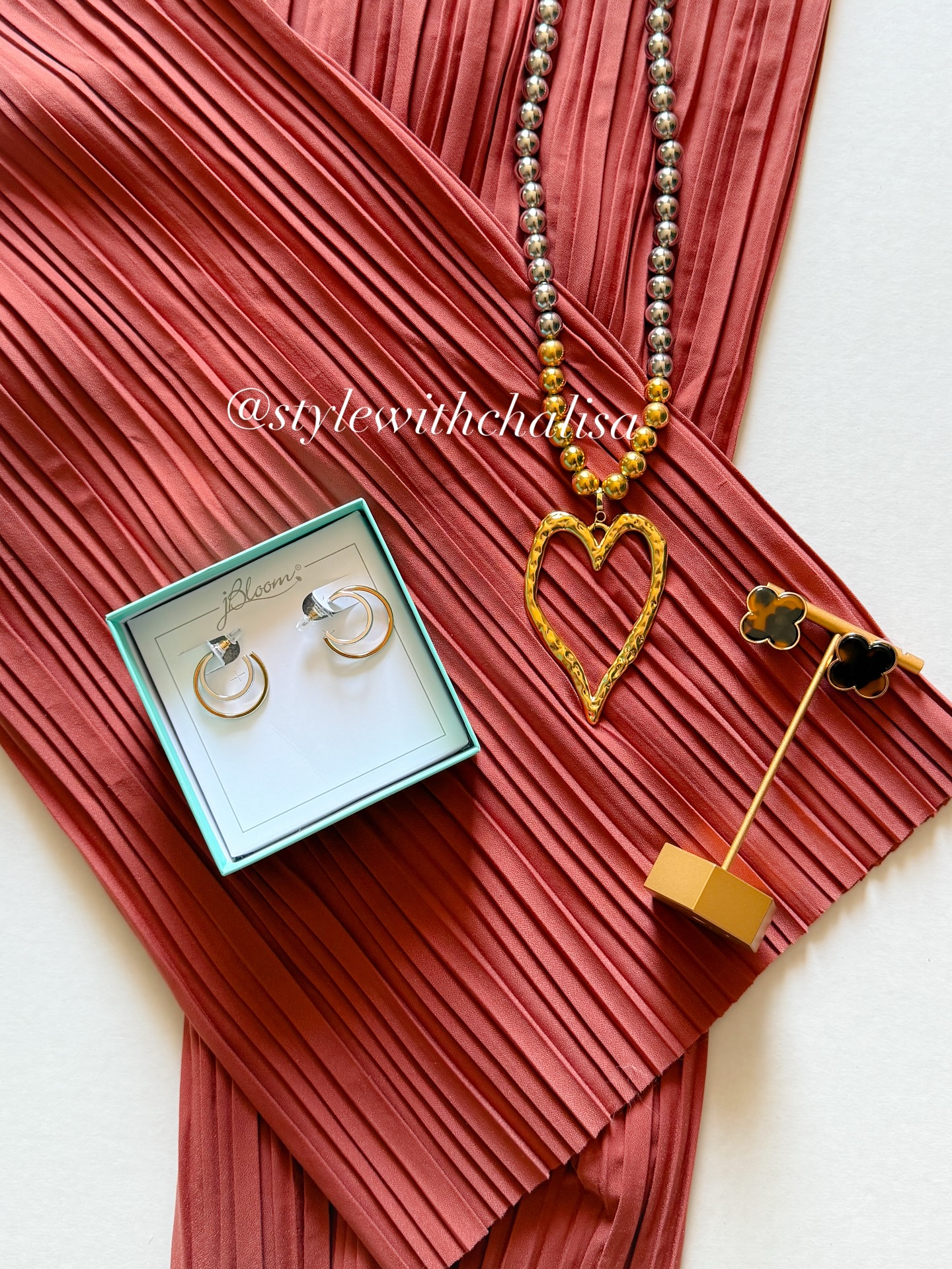 Say hello to Chili Oil — Pantone’s perfect fall hue! 🔥
Rich, bold, and oh-so-cozy, this color is giving us all the autumn vibes.

Paired with 2-tone hoops, a statement heart pendant, and chic clovers, it’s the ultimate mix of spice + sparkle. 

Would you rock this fall shade in your wardrobe or accessories first? 👇

#jbloom #stylewithchalisa #styledlifewithchalisa #fallfashion #pantone #chilioil #permalinxbyjbloom #bloomcrew